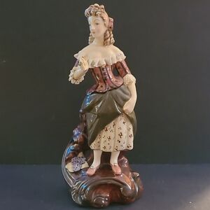 Elegant Porcelain Figurine with Brown and Cream Accents